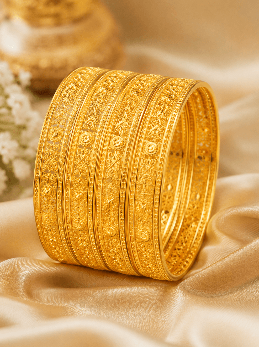 Classic 22K gold bangles set with intricate work